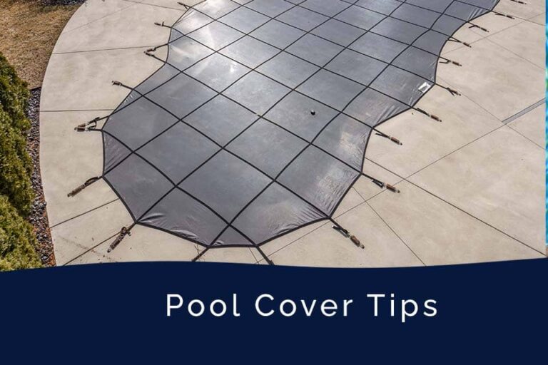 Heavy duty winter pool cover installed on a rectangular swimming pool.